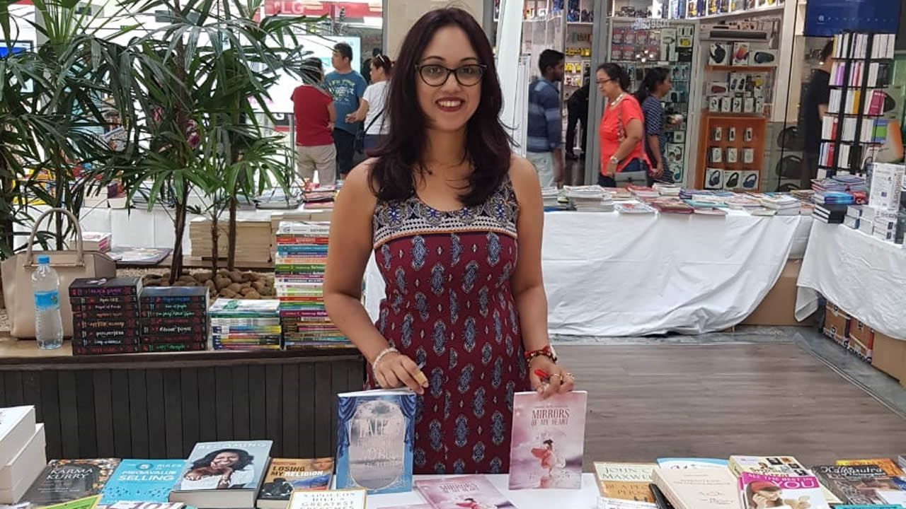 Anousheka Gangabissoon selling her works at a book  exhibition hosted by the Editions de l’Océan Indien.